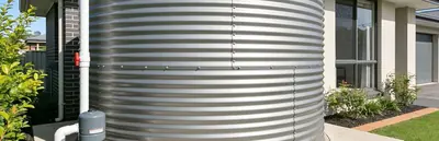 Domestic rainwater tank installed beside a house